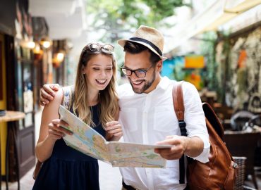 Tourist couple traveling. Travel. Walking on street. Portrait of beautiful young people